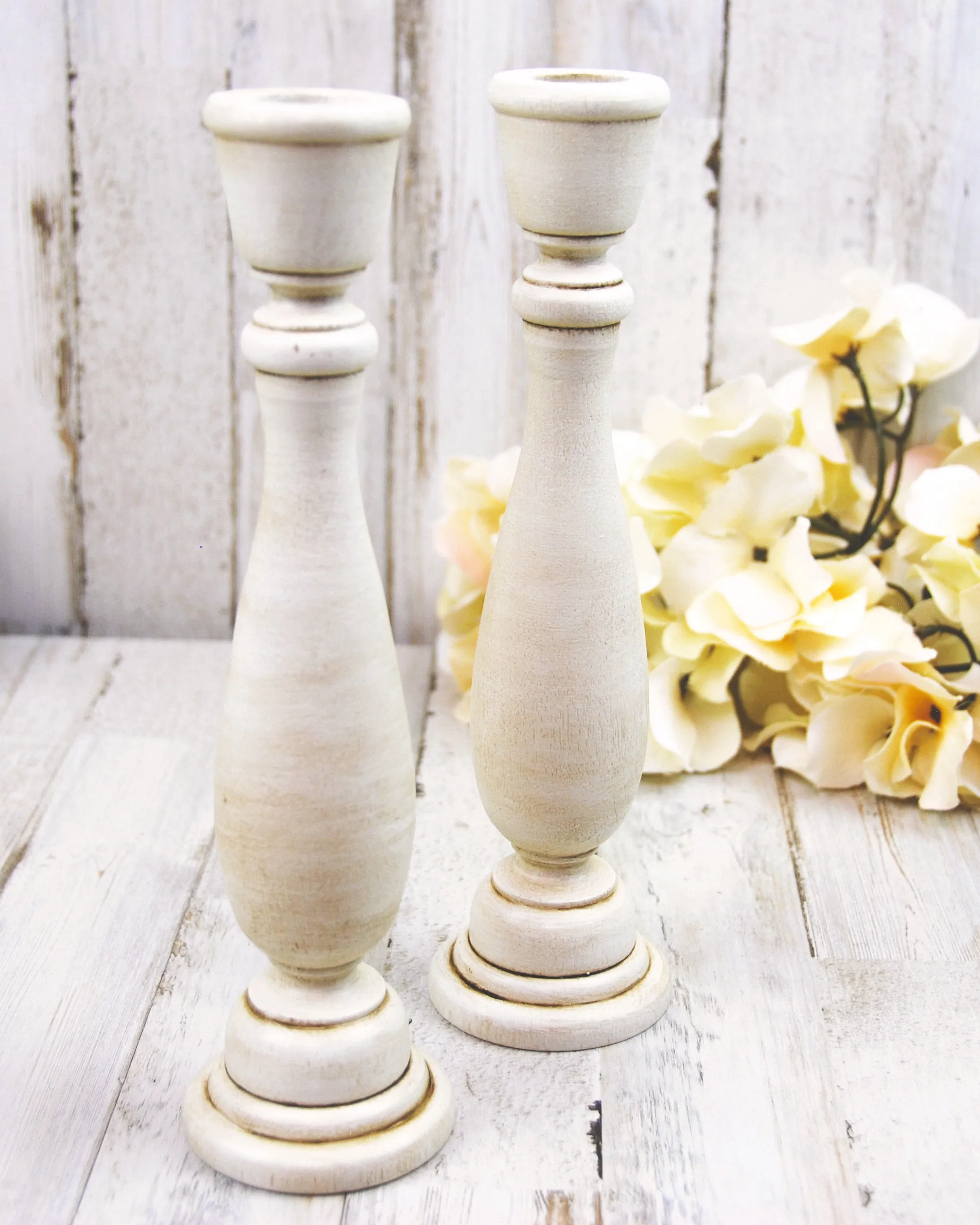 Ivory painted wooden spindle candlesticks
